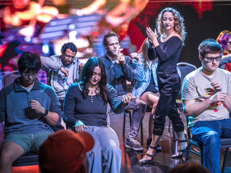 Marc Savard in action with hypnotized volunteers at Nathan Burton Theater